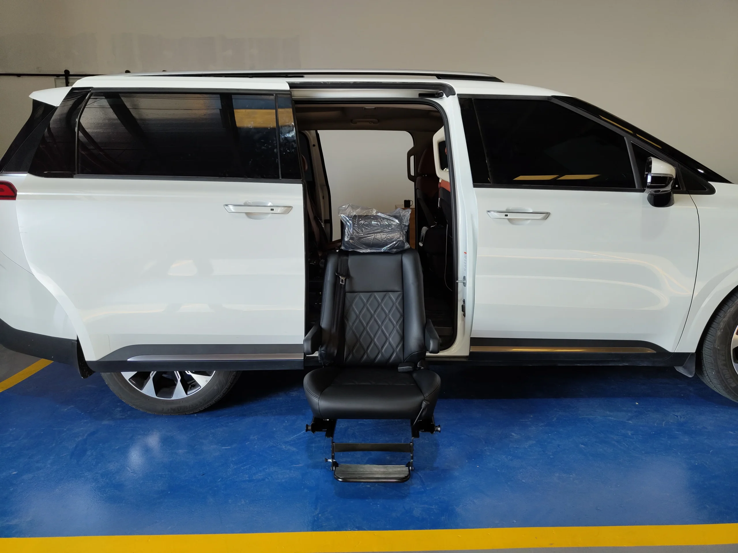Turny Orbit Seat installed in minivan behind front passenger seat for mobility access
