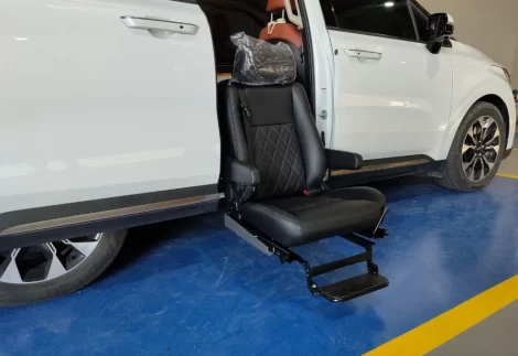 Exterior view of Turny Orbit Swivel Seat lowering outward to assist disabled passenger