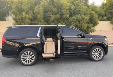Passenger side exterior view of Swivel Seat in GMC Denali extending from back of front passenger seat