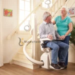 A disable man using stairlift with the help of his wife in Dubai UAE