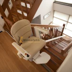 A wheelchair lift for stairs in white color by Manafeth