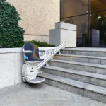 Chair lift for stairs installed outside for public use