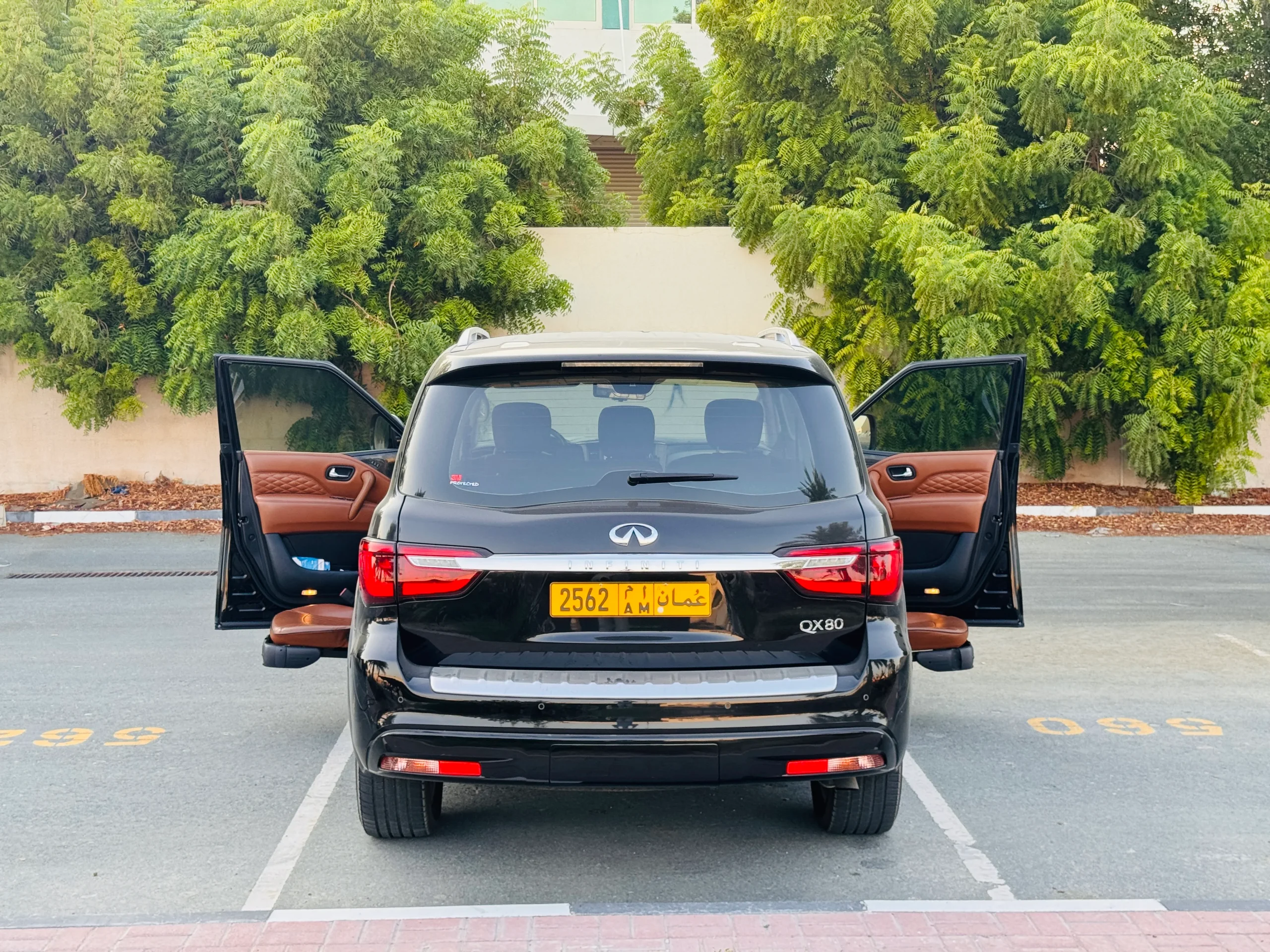 Exterior wide view of Infiniti QX80 with two front swivel seats installed by Manafeth