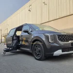 Kia Carnival Turny orbit out front view in Dubai by Manafeth