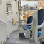 Stairlift standing at top in Dubai by Manafeth Mobility UAE