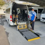 Toyota Hiace with wheelchair lift for disabled players by Manafeth