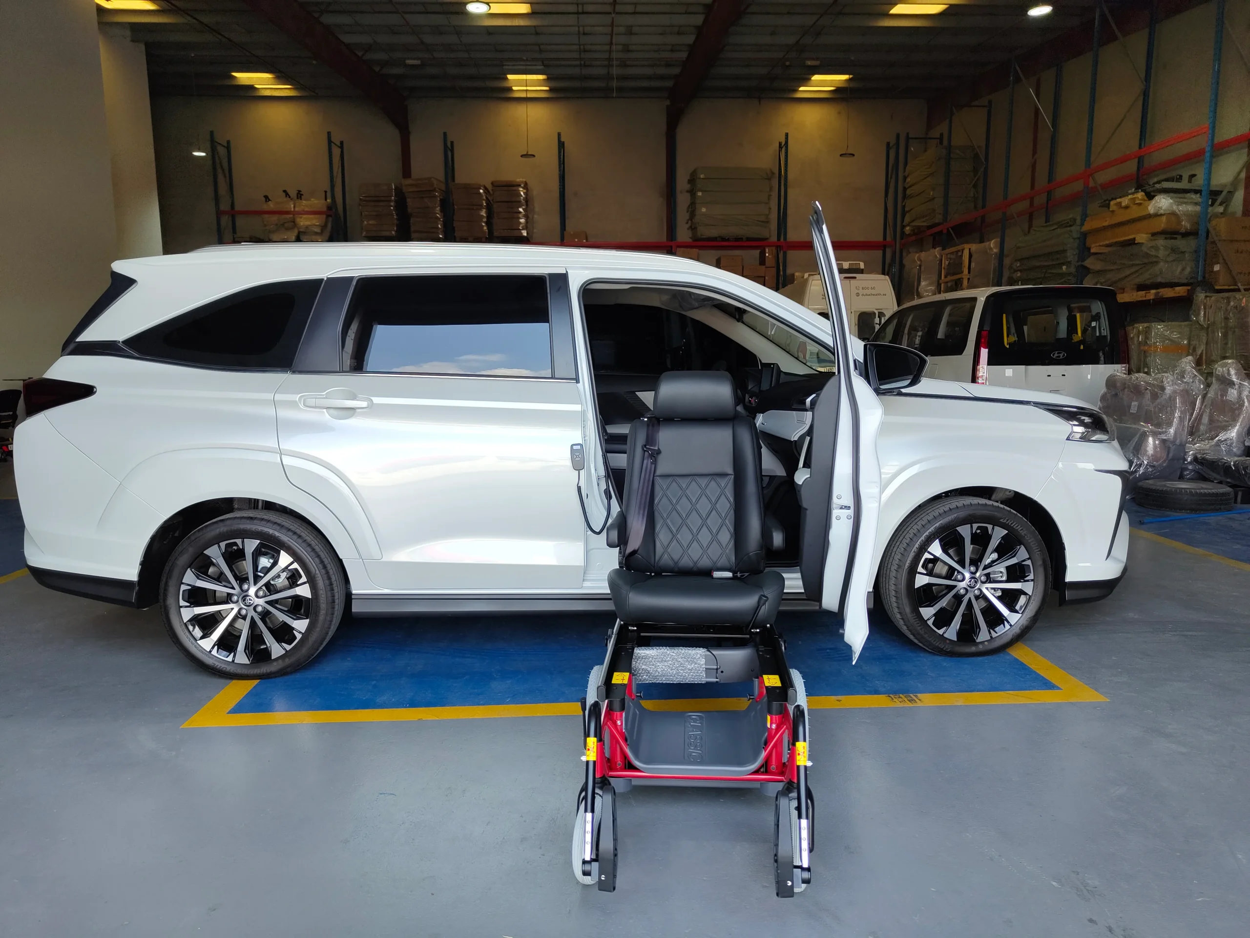 Passenger side view of Toyota Veloz with Turny Seat and Carony Classic wheelchair system