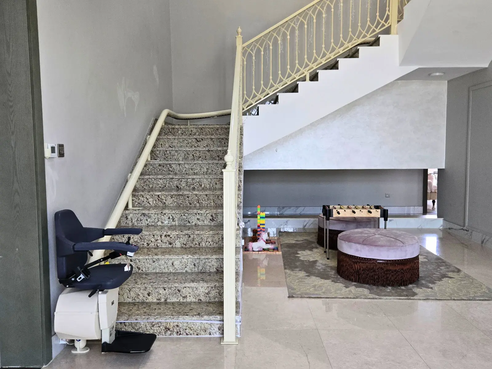 Single rail Handicare Curved chair lift for stairs